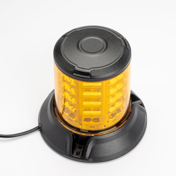 Amber warning light with black base on a white background